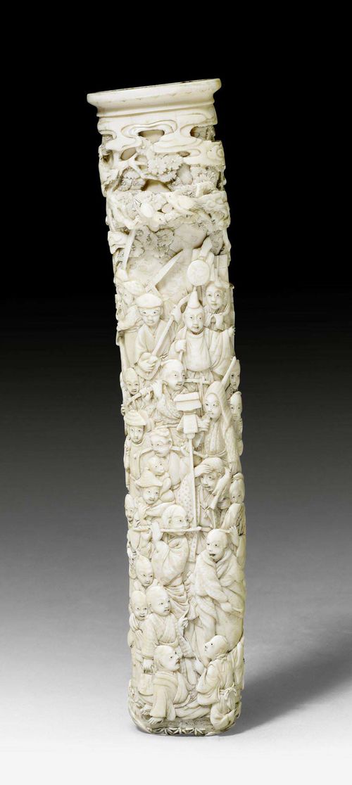A FINELY CARVED IVORY TANTÔ SCABBARD. Japan, Meiji period, L 21.5 cm. Plug at the tip damaged.