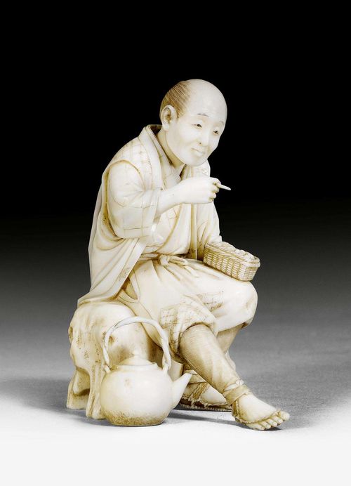A FINE IVORY OKIMONO OF A RESTING MAN DRINKING TEA. Japan, Meiji period, height 8 cm.