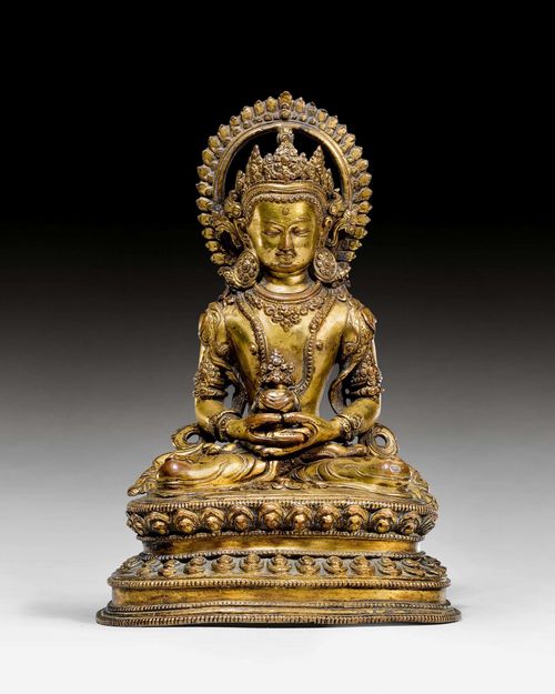 A  GILT COPPER FIGURE OF AMITAYUS ADORNED WITH A HEAD AUREOLE. Nepal, 17th c. Height 18 cm.