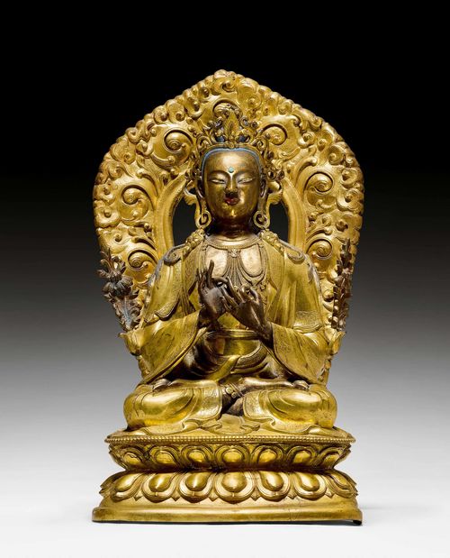 A GILT BRONZE FIGURE OF MAITREYA WITH A REPOUSSÉ AUREOLE. Tibeto-chinese, 18th c. Height 29 cm (including the aureole). Lotuses at the shoulder replaced.