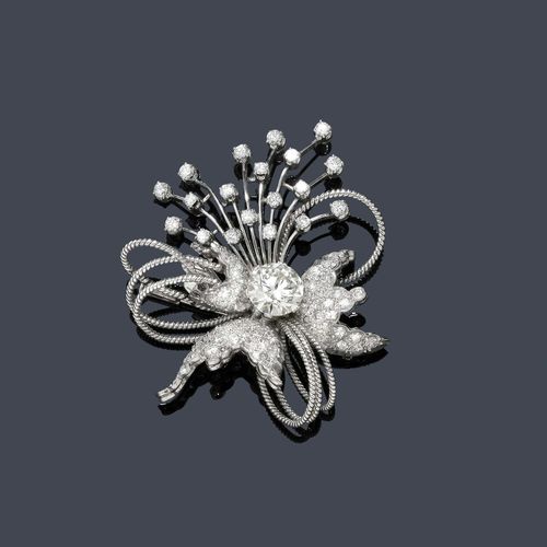 DIAMOND BROOCH, ca. 1950. White gold 750. Fancy brooch designed as a stylized bouquet, set in the middle with 1 brilliant-cut diamond of ca. 3.20 ct, ca. M-N/ SI1, within a border of 3 leaf motifs set throughout with ca. 60 single-cut diamonds weighing ca. 1.30 ct and additionally decorated with loop motifs of corded gold wire as well as 18 brilliant-cut diamonds weighing ca. 0.70 ct. Ca. 5.4 x 4.8 cm Tested by Gemlab..