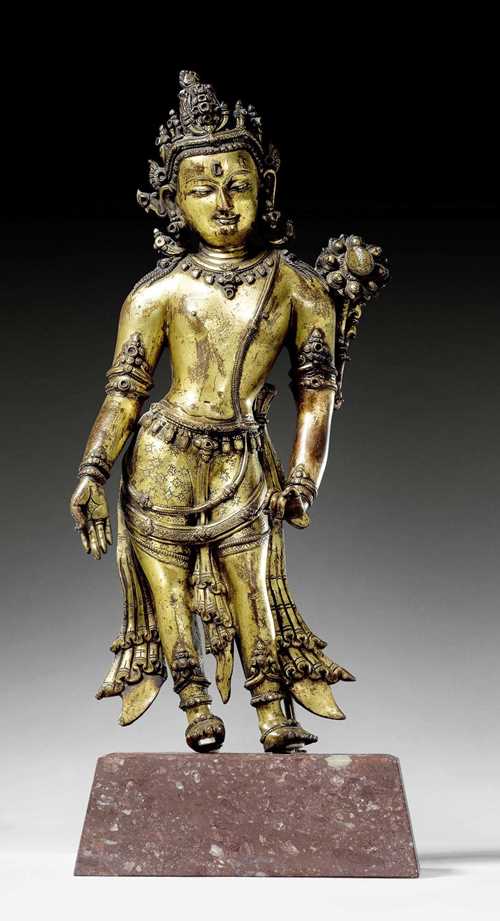 A LARGE GILT COPPER FIGURE OF THE STANDING PADMAPANI. Nepal, 13th c. Height 41 cm. Left underarm replaced, lotus base lost.