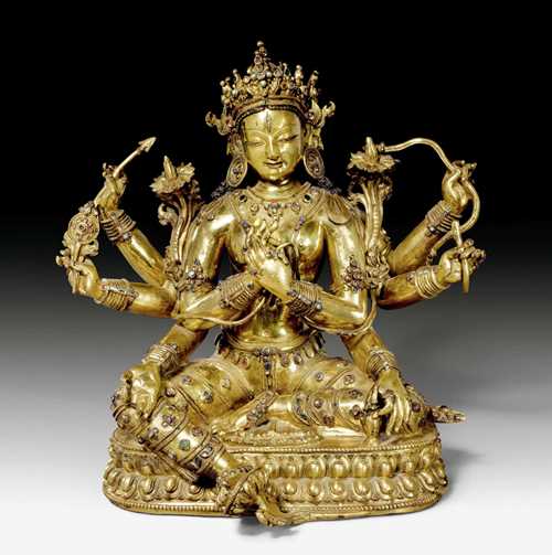 A MAGNIFICENT GILT COPPER FIGURE OF A PANCARAKSHA GODDESS. Nepalese school in Tibet, 14th/15th c. Height 32 cm. Inset with precious stones.