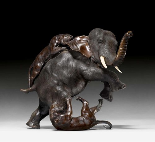 A DRAMATIC BRONZE SCULPTURE OF AN ELEPHANT ATTACKED BY TWO TIGERS. Japan, Meiji period, height 27 cm. Tail damaged.