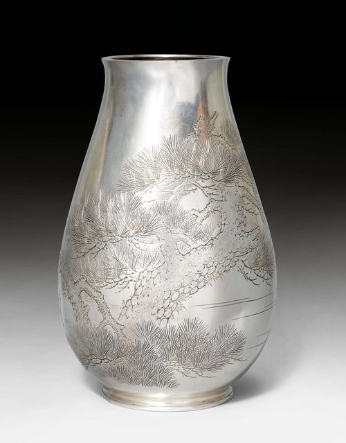 A LARGE SILVER HATTORI VASE INCISED WITH PINE TREES. Japan, Meiji-/Taisho period, height 41 cm. Marked "Jungin Hattori sei".