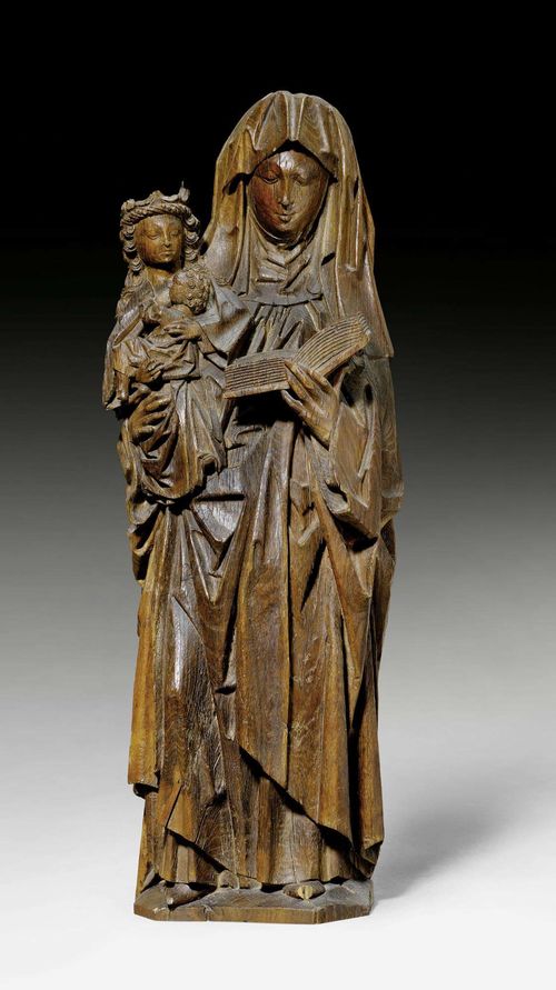 VIRGIN AND CHILD WITH SAINT ANNE, late Gothic, Flanders ca. 1500. Carved oak and verso flattened. Saint Anne is standing with a book in her left hand and carrying Mary and Jesus in her right hand. Cracks. H 79 cm. Provenance: from a French collection.