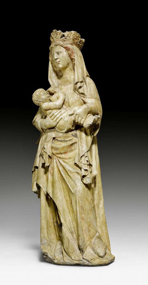 THE NURSING MADONNA, Gothic, North-Eastern France, middle of the 14th century. Limestone, sculptured all around, verso partially flattened and with remains of paint. Verso inscribed 17 in white ink and bearing the red inventory number 32523... on the base area. Minor chips. H 75 cm. Provenance: private collection, Lugano. Expertise: - technical expertise by Prof. John Larson, 24 March 1997, confirming that the work stems from the early 14th century. - examination of the pigment residue by Dr. Paolo Cornale, Consulting Scientific Group Palladio, Milan, 8 February 2001. The pigments examined are dated at ca. 1350.