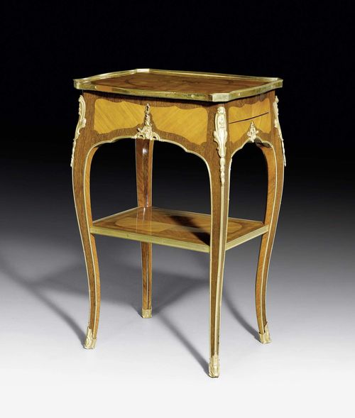 GUERIDON, so-called "table en cabaret", Louis XV, attributed to B. VAN RISENBURGH (Bernard II Van Risenburgh, maître 1735), Paris ca. 1750. Purpleheart and satinwood in veneer and inlaid in "bois de bout" with flowers, leaves, fillets and ornamental frieze. 1 drawer on the side. Exceptionally matte and polished gilt bronze mounts and sabots. Free-standing. 43x33x67 cm.