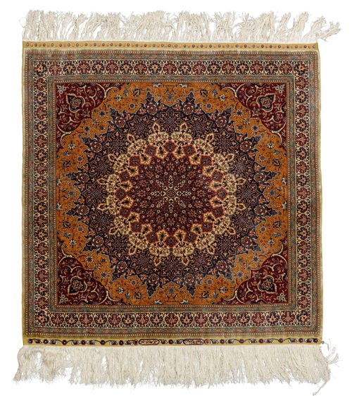 HEREKE SILK.Fineness: 16x16 knots/cm2. Red, white and blue central medallion on a beige ground and red corner motifs, finely patterned with trailing flowers and palmettes in harmonious colours, white border, in good condition, 91x96cm.
