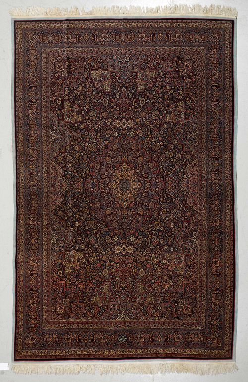 MASHHAD old.Black central field with a red and beige central medallion, opulently patterned with trailing flowers and palmettes, red border with trailing flowers, in good condition, 200x301cm.