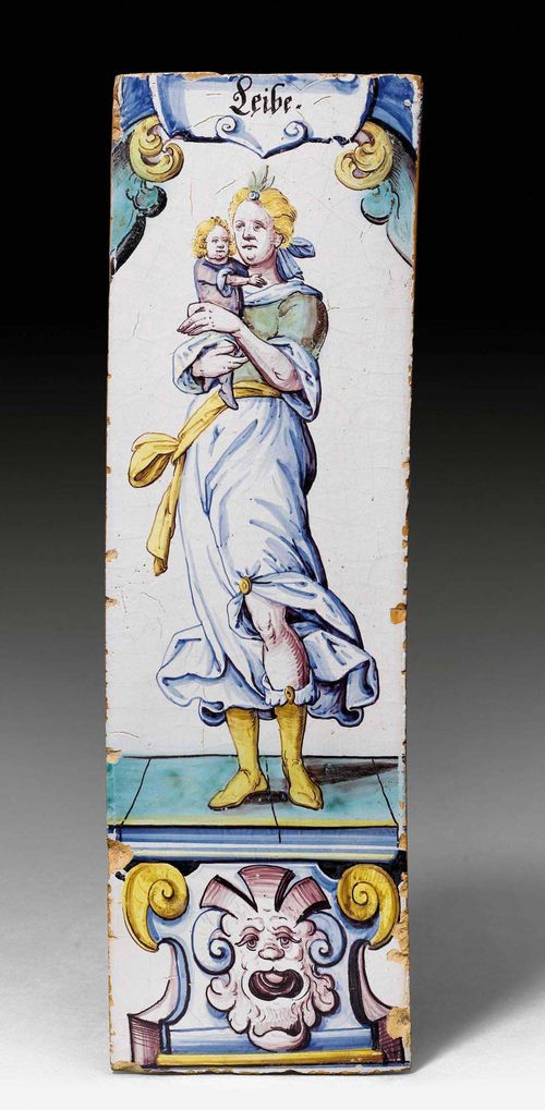 CERAMIC TILE 'LEIBE', Winterthur, ca. 1650-1670. Love personified as a mother holding her child on her arm, entitled "Leibe", painted in the typical colours blue, manganese red, green and yellow. Provenance: Collection Dr. Meyer-Werthemann, Zurich.