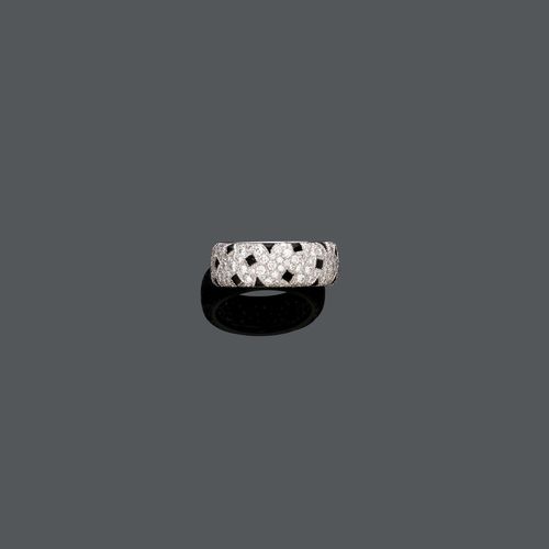 DIAMOND ONYX PANTHER RING, BY CARTIER. White gold 750. Designed as a pavé-set diamond panther and set with black onyx spots. Diamonds weighing ca. 2.60 ct. Signed Cartier no. 47102A. Size ca. 49.