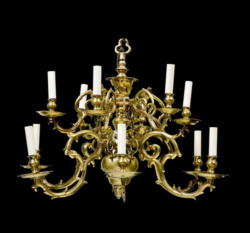 CHANDELIER, Baroque, the Netherlands ca. 1700. Bronze and brass. Baluster-shaped shaft with 12 curved and scrolled light branches with broad plates and vase-shaped nozzles on 2 levels. Fitted for electricity. D 85 cm. H 70 cm.