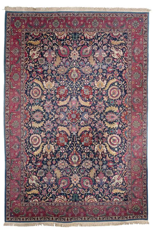 PERSIAN old.Blue ground, opulently patterned with trailing flowers and palmettes, wine-red border with tendrils, 263x352 cm.