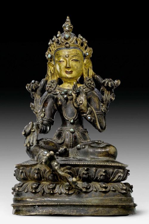 A PARTLY PAINTED BRONZE FIGURE OF THE GREEN TARA WITH STONE INLAYS. Tibet, 16th/17th c. Height 15 cm.