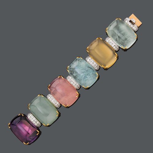 GEMSTONES AND GOLD DIAMOND BRACELET, ca. 1970. Yellow gold 750, 211g. Composed of 6 different semi-precious gemstones cabochons, amethyste, chalcedony, pink quartz, aquamarine and citrine of ca. 35 x 23 mm, the connecting links set with brilliant-cut diamonds, weighing ca. 15.00 ct. L ca. 18,5 cm.