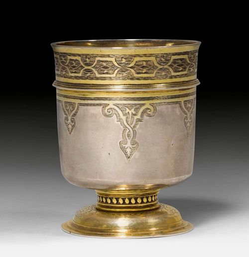 PARCEL-GILT FOOTED BEAKER,probably Zurich, ca. 1600. Maker's mark designed as the coat-of-arms of the Spross family. French import mark. Round, stepped foot. H 9.5 cm, 165 g.