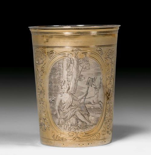 PARCEL-GILT BEAKER,Schaffhausen, 17th century. Maker's mark Hans Georg Ott I. Conical beaker, the wall engraved with cartouches and floral decoration. The bottom with embossed inscription. Wall dented. H 9.7 cm, 145 g.