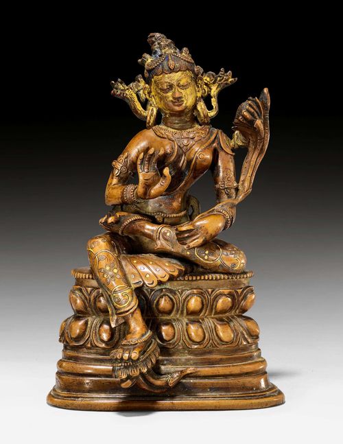 A COPPER ALLOY FIGURE OF THE GREEN TARA WITH SILVER AND GOLD INLAYS. China, Pala style, 18th/19th c. Height 18 cm. Unsealed.