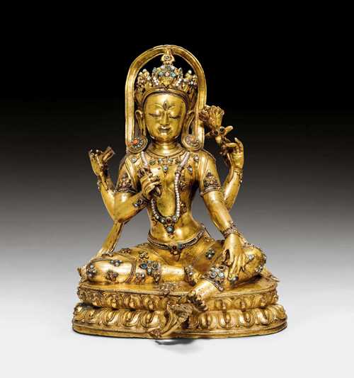 A MAGNIFICENT GILT COPPER FIGURE OF A FOUR ARMED GODDESS. Tibet, 14th/15th c. Height 30 cm. Very possibly from Densatil monastery. Unsealed. ***This item is subject to special bidding conditions, please let us know if you wish to bid on it***