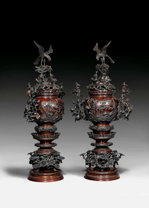 A PAIR OF MONUMENTAL BRONZE INCENSE BURNERS. Japan, Meiji period, height 115 cm. Elaborately decorated with flowers and birds.