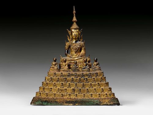 A LACQUER GILT BRONZE FIGURE OF BUDDHA ON A "1000 BUDDHA"-THRONE. Thailand, Rattanakosin, 19th c. Height 38 cm.