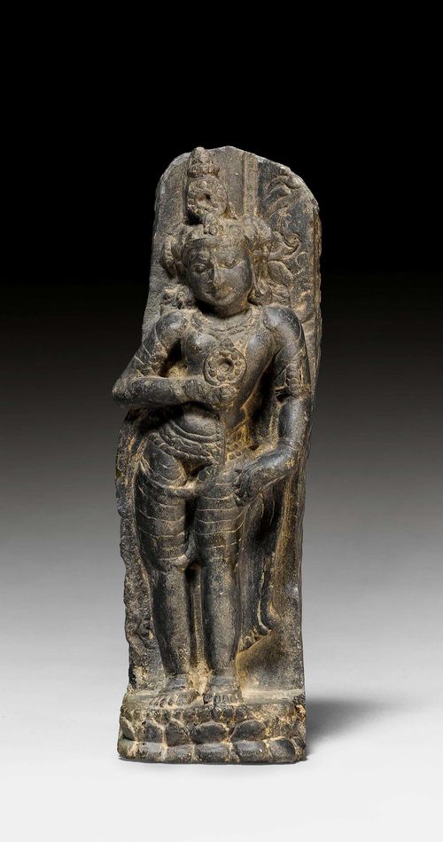 A SMALL STANDING BLACK STONE FIGURE OF A MALE DEITY. India, Pala, ca. 12th c. H 18.5 cm. Possibly a personification of Vishnu's cakra.