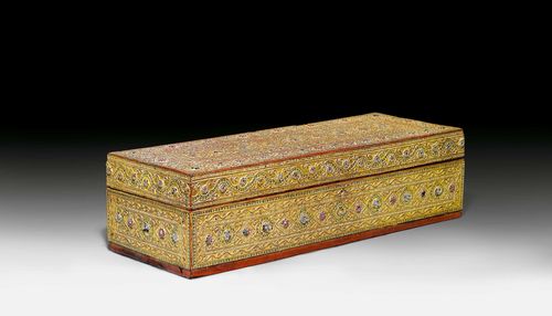 A GOLD LACQUER MANUSCRIPT BOX WITH GESSO AND GLASS DECORATIONS. Burma, 19th/20th c. 71x25x19 cm.
