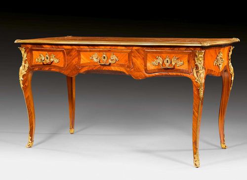 BUREAU PLAT,Louis XV, in the style of P. ROUSSEL (Pierre Roussel, maitre 1745), Paris circa 1760. Tulipwood and rosewood in veneer, inlaid with reserves and fillets. The top lined with gold-stamped brown leather and edged in bronze, on a frieze in "contour a l'arbalete". Front with broad central drawer flanked by one drawer on each side. Same, but sham arrangement verso. Bronze mounts and sabots. 148x75x80 cm. Provenance: - Collection of Jacques Arpels, Paris. - From a European collection.