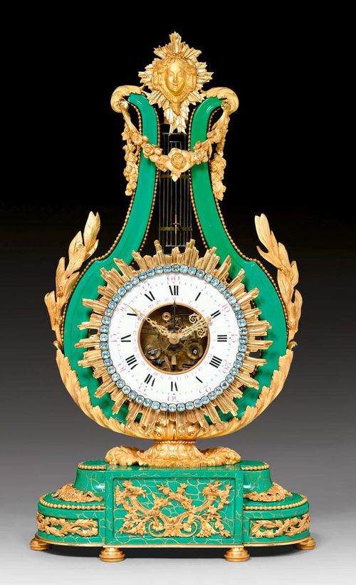 LYRE CLOCK WITH GREEN PORCELAIN,late Louis XVI, the porcelain from the Manufacture de Sevres, Paris, 19th century. Green porcelain with parcel gold craquelure. Enamel chapter ring with paste stone edging. Fine skeleton movement striking the 1/2 hours on bell. Exceptionally fine, matte and polished gilt bronze mounts and applications. 34x14x61 cm. Provenance: - Former collection of Duesberg, Mons. - Swiss private collection.