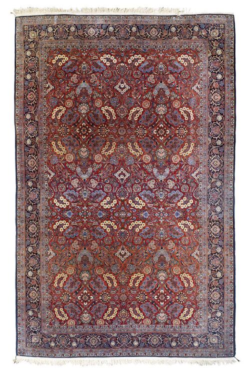 KESHAN old.Rust coloured ground, patterned throughout with colourful flower motifs, dark blue border, good condition, 510x320 cm.