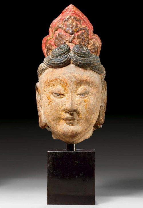 A FINE STONE HEAD OF A BODHISATTVA. China, Liao dynasty 11th c. Height 34 cm. Crown and hair painted, traces of gilding. Originally from the collection of Gerhard Versteegh, a friend of King Gustav VI of Sweden.