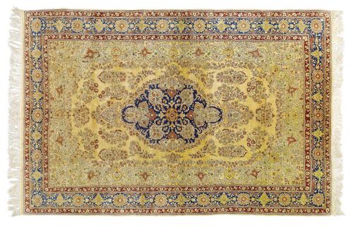 HEREKE silk old.Blue central medallion on a yellow ground. The entire carpet is finely patterned with trailing flowers in attractive pastel colours. Blue border. Good condition, 205x300 cm.