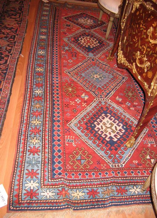 BORTSCHALU antique.Red central field with four medallions, stepped border, good condition, 285x130 cm.