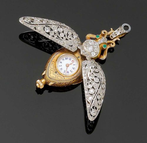 DIAMOND AND EMERALD PENDANT WATCH, ca. 1890. Platinum and yellow gold. Very decorative, rare pendant watch in the shape of a beetle. The floral open-worked wings and the body completely set with 135 old mine cut diamonds set in platinum and totalling ca. 3.50 ct. The body of matte-finished, finely engraved gold, appliqued legs, 2 small emeralds for eyes. Miniature watch with an enamelled dial, blue Arabic numerals, cylinder movement.