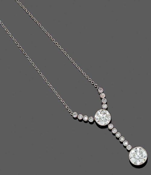 DIAMOND NECKLACE, ca. 1910. Platinum. Fine "Y"-shaped necklace with anchor chain, the top set with 1 old mine cut diamond of ca. 1.00 ct, ca. K/SI2 flanked by 8 small old mine cut diamonds totalling 0.10 ct. Pendant: 1 old mine cut diamond of ca. 1.40 ct, ca. I / VS-SI in a Millegrain setting, on a movable mount below a diamond line of 6 small diamonds totalling ca. 0.12 ct. L ca. 44 cm.
