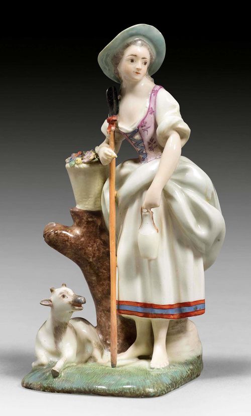 SHEPHERDESS WITH FLOWER BASKET AND GOAT, ZURICH, MODEL CIRCA 1770-75.Underglaze blue mark Z and two dots. H 14 cm. Restored. Comparable pieces: Ducret II, ill. 429, 436, 437; KFS 122, p. 56, No. 75.