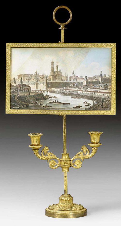CANDELABRA WITH VEDUTA LIGHT SHADE,Empire/Restauration, Russia circa 1810/30. Matte and polished gilt bronze and watercolor veduta of the Moscow Kremlin. Height-adjustable veduta behind glass. Height-adjustable light branches. H 63 cm.