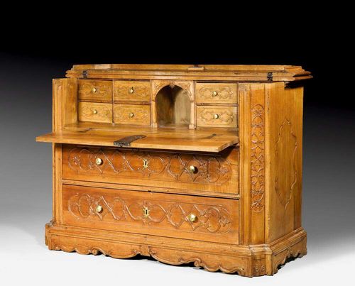 CARVED WALNUT BUREAU,Renaissance, Northern Italy, 17th century With 4 drawers at the front, the top drawer forming a fall-front writing surface enclosing a fitted interior with compartments and drawers. With bronze and wooden knobs. 154x60x(open 98)x90 cm.