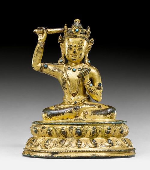A SMALL GILT COPPER ALLOY FIGURE OF MANJUSHRI. Tibet, 16th c. Height 10.5 cm. Consecration plate lost.