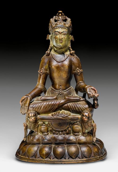 A RARE COPPER ALLOY FIGURE OF AVALOKITESHVARA ON A LION THRONE. Swat valley, 7th/8th c. Height 21.5 cm. Mongolian inscription. Back damaged.