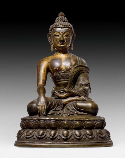 A BRONZE FIGURE OF BUDDHA SHAKYAMUNI WITH REMAINS OF COLD GILDING. Tibeto-chinese, 18th c. Height 16 cm.