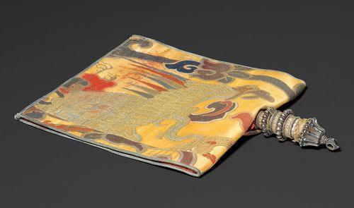 A FINE COPPER AND SILVER CHABLU WATER FLASK WITH YELLOW SILK BROCADE. Tibet, antique, length 16 cm (without brocade). Gilt details.
