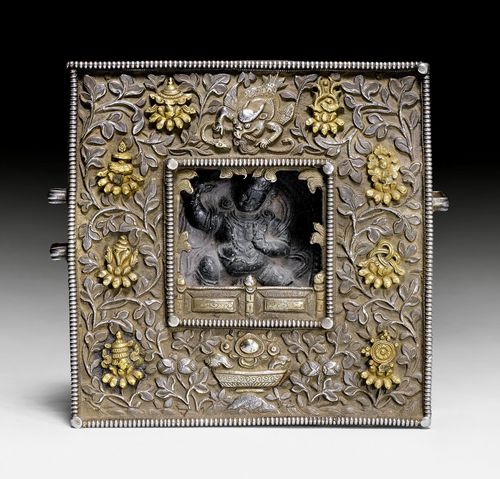 A SQUARE SHAPED PARTLY GILT CHASED REPOUSSE SILVER G'AU WITH TSATSA. Tibet, 19th/20th c.12.5x12.5cm.