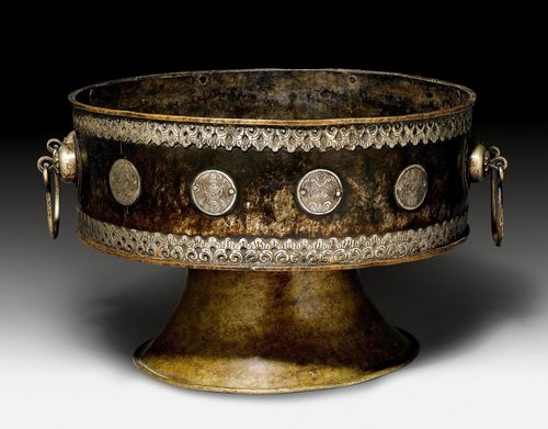 A LARGE BRASS RITUAL VESSEL WITH WHITE METAL DECORATIONS. Tibet, around 1900, height 35.5 cm, diam. 60 cm.