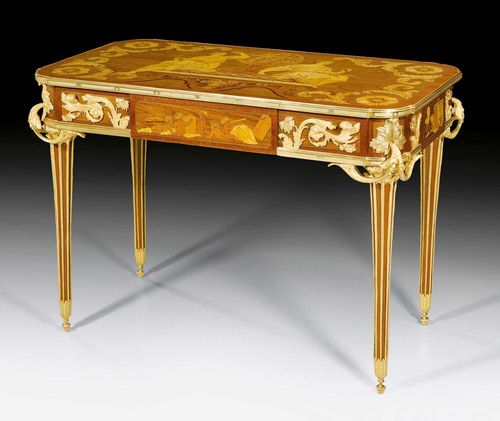 BUREAU-PLAT "A L'ASTRONOMIE",Louis XVI style by F. LINKE (François Linke, 1855-1946), after designs by J.H. RIESENER (Jean-Henri Riesener, Maitre 1768), Paris circa 1890. Tulipwood, rosewood and partly dyed precious woods in veneer and finely inlaid with depictions of Urania and globe, flanked by Kalliope with further allegories and emblems. The top edged in bronze moulding, with fine pyramid legs, a central drawer opening with push button mechanism, and the same but sham arrangment verso. With exceptionally rich gilt bronze mounts, applications and sabots. 124x63x78 cm. Provenance: from an English collection.