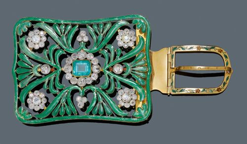 ENAMEL, EMERALD AND DIAMOND BELT CLASP, France, ca. 1890. Yellow gold. Very decorative, rectangular belt buckle of floral openwork design, decorated throughout with translucent green and red enamel. The rosette motif in the centre set with 1 octagonal, Columbian emerald of ca. 5.70 ct within a border of 12 old European-cut diamonds weighing ca. 3.80 ct. Four additional rosette motifs with a total of 36 old European-cut diamonds weighing ca. 5.00 ct and 8 additional diamonds weighing ca. 2.10 ct. French maker's mark PP or FP. Ca. 9 x 7 cm. From the heirs of Baron Anton Kiss (1880-1970), son of Katharina Schratt, Schloss Mondsee.