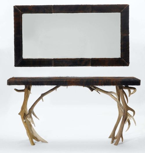 CONSOLE WITH MIRROR,in the rustic style. Deer antlers and brown cow hide. 160x46x83 cm. Rectangular mirror, 80x151 cm. small losses.