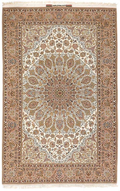ISFAHAN old.White central field with a beige central medallion, finely patterned with trailing flowers and palmettes in light colours, good condition, 232x150 cm.