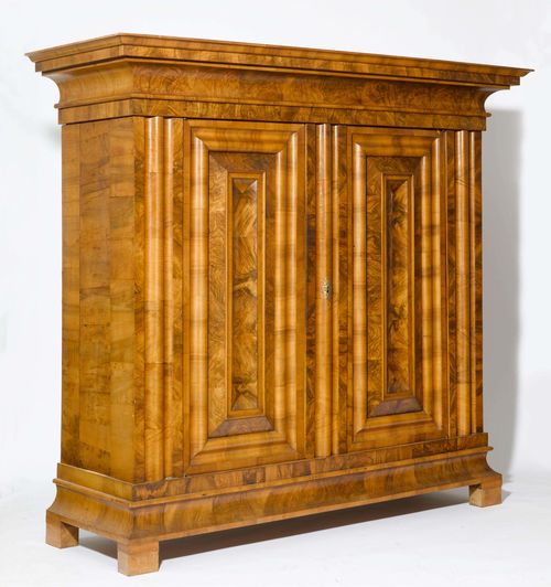 BAROQUE CUPBOARD or "WELLENSCHRANK ", 18th century. Walnut and burlwood. Rectangular body. Iron lock. 214x76x198 cm. Door fillings and lateral walls, restored. Some losses to the veneer.